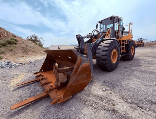 Large construction vehicle with front loader attachment.